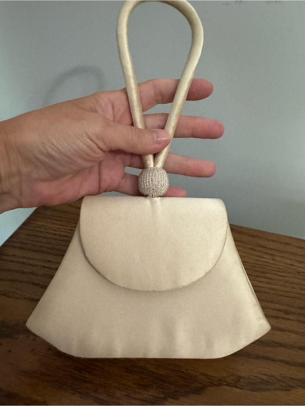 La Regale Cream Satin Evening Clutch with Beaded Knot Handle